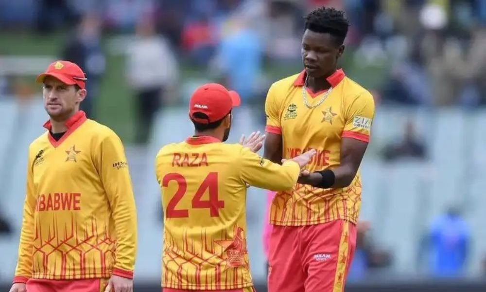 Blessing Muzarabani with Sikandar Raza and a Zimbabwe teammate during a cricket match