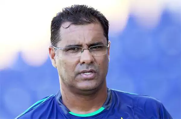 former Pakistani fast bowler wearing a blue cricket training jersey known for pace bowling and yorkers